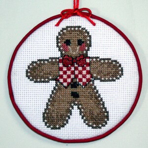 Completed Gingerbread Man Cross Stitch Hang-up, Aida cloth, DMC floss