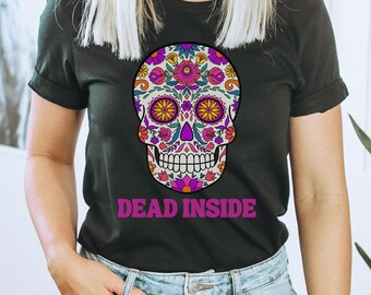 May include: Black t-shirt with a colorful sugar skull graphic and the text "DEAD INSIDE" in pink.