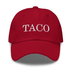 May include: A red baseball cap with the word "TACO" embroidered in white across the front. The cap has a curved brim and a rounded crown. This hat is a fun accessory.