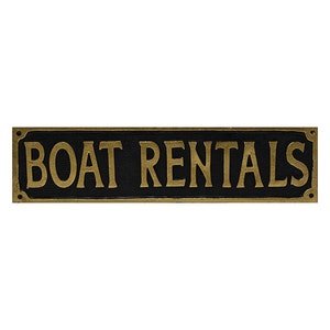 May include: A black and gold sign with the text "BOAT RENTALS" in gold lettering.