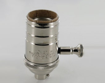 May include: A nickel-plated light bulb socket with a side switch. The socket has a threaded base and a side switch for easy on/off control.