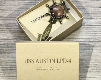 Historical Bookmark made of walnut timber removed from the USS Austin LPD-4