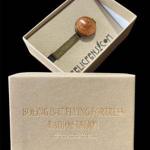 Historical antiqued brass tie clip made using wood from a radio station from a Boeing B-17 Flying Fortress