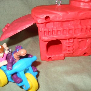 Flintstone House with Pebbles and Dino