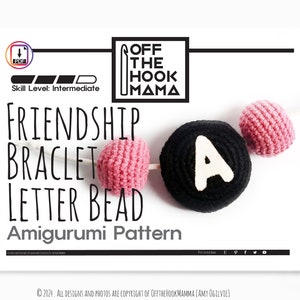 May include: A crochet pattern for a friendship bracelet with a letter bead. The pattern is called "Friendship Bracelet Letter Bead Amigurumi Pattern" and is by Off The Hook Mama. The image shows a pink and black crochet bead with the letter "A" on it.