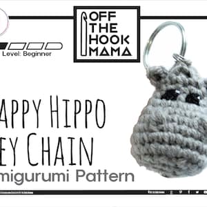 May include: A crochet amigurumi pattern for a happy hippo keychain. The pattern is for beginners and includes a PDF download. The image shows a gray crocheted hippo keychain with black eyes.