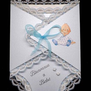 3D baby shower card in the shape of a blue swaddle baby pattern blue ribbon and Calais lace