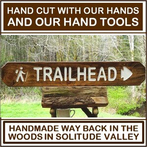 TRAILHEAD with hiker and arrowhead, park style path hiking trail cabin campground sign. Carved routed reflective lettering & symbols MN002Nx