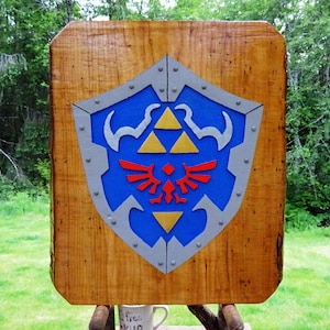 Legend of Zelda HYLIAN SHIELD, fantasy adventure game sign. Hand carved routed painted 3D Triforce emblem with raised steel rivets sos494