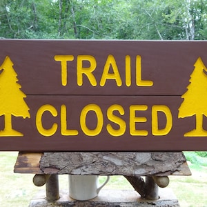 TRAIL CLOSED National Park style path trail drive street road cabin lodge camp sign. Hand carved routed reflective letters & trees MAN002O+