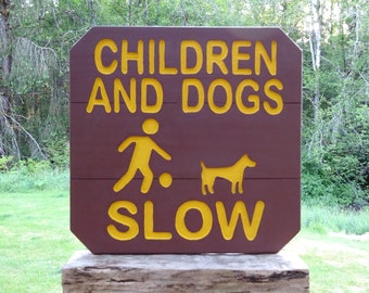 CHILDREN & DOGS at PLAY sign, park style road drive street cabin campground. Hand carved routed painted reflective letters symbols MAN000T+