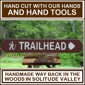TRAILHEAD with hiker and arrowhead, park style path hiking trail cabin campground sign. Carved routed reflective lettering & symbols MN002Nx
