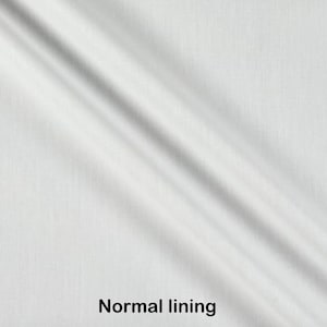 May include: Close-up of a white fabric with a subtle texture. The fabric is folded and the text "Normal lining" is visible at the bottom of the image.