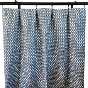 May include: A set of blue curtains with a white heart pattern. The curtains are hung on a black rod.