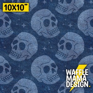 May include: A seamless pattern featuring white skull silhouettes on a blue denim background. The skulls are repeated throughout the pattern, creating a spooky and stylish design. The text "WAFFLE MAMA DESIGN." is also included in the pattern.