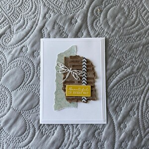 May include: A white card with a yellow and brown paper background. The background has a white dragonfly and a yellow tag with the text "Beautiful in every way".