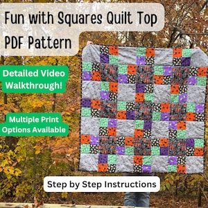 May include: A colorful quilt top with a square pattern, featuring gray, orange, purple, and green squares. The quilt is held up in front of a fall foliage background. Text on the image reads "Fun with Squares Quilt Top PDF Pattern" and "Step by Step Instructions."