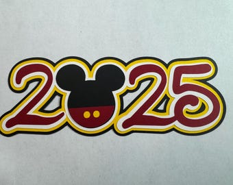 May include: A red and yellow layered paper cutout of the year 2025 with a black Mickey Mouse head in the center.
