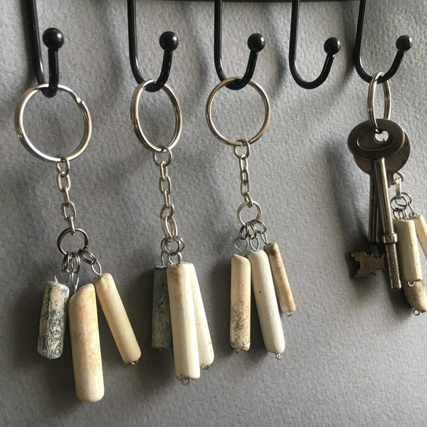 Keyring holders made from fragments of old clay pipes selected from the River Thames foreshores