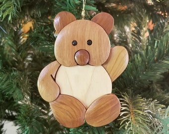 TEDDY BEAR Christmas ORNAMENT.  This cuddly teddy bear can hold it's own amid the most bright holiday tree.