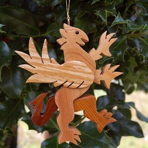 GRIFFIN CHRISTMAS ORNAMENT A legendary mythical creature with body of a lion and and head, and wings of a bird. image 5