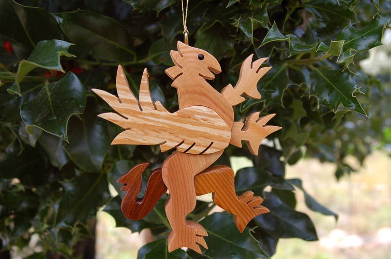 GRIFFIN CHRISTMAS ORNAMENT A legendary mythical creature with body of a lion and and head, and wings of a bird. image 5