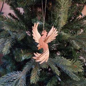 Adorno navideño tallado de Fénix. Una criatura alada legendaria, un místico pájaro de fuego, un adorno para tu árbol de Navidad.