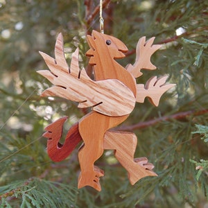 GRIFFIN CHRISTMAS ORNAMENT A legendary mythical creature with body of a lion and and head, and wings of a bird. image 2