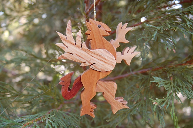 GRIFFIN CHRISTMAS ORNAMENT A legendary mythical creature with body of a lion and and head, and wings of a bird. image 2