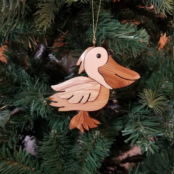 PELICAN CHRISTMAS ORNAMENT Carving.  A miniature work of art, perfect for the bird lover to trim their holiday tree.