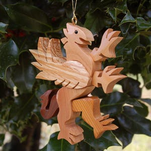 GRIFFIN CHRISTMAS ORNAMENT A legendary mythical creature with body of a lion and and head, and wings of a bird. image 4