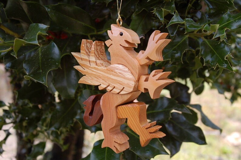 GRIFFIN CHRISTMAS ORNAMENT A legendary mythical creature with body of a lion and and head, and wings of a bird. image 4