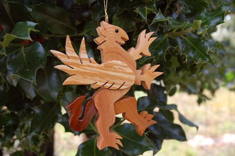 GRIFFIN CHRISTMAS ORNAMENT A legendary mythical creature with body of a lion and and head, and wings of a bird. image 3