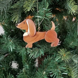 DACHSHUND CHRISTMAS ORNAMENT    Dog lovers will cherish this charming and endearing pup.