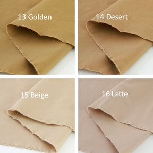 Puede incluir: Cuatro muestras de tela en tonos beige y marr&oacute;n. Las muestras est&aacute;n etiquetadas como "13 Golden", "14 Desert", "15 Beige" y "16 Latte". La tela tiene un borde sin rematar y los colores var&iacute;an de claro a oscuro.