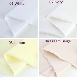 Puede incluir: Cuatro muestras de tela en blanco, marfil, lim&oacute;n y beige crema. Cada muestra est&aacute; doblada, mostrando la textura y las variaciones de color. La muestra superior izquierda est&aacute; etiquetada como "01 White", la superior derecha "02 Ivory", la inferior izquierda "03 Lemon" y la inferior derecha "04 Cream Beige".
