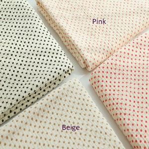 May include: Four fabric swatches with white backgrounds and different colored polka dots. The swatches are labeled "Pink", "Beige", and "Black".