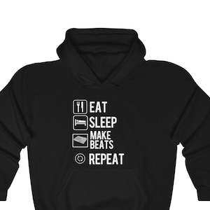 May include: Black hooded sweatshirt with white text that reads "Eat, Sleep, Make Beats, Repeat" with a graphic of a music mixer.