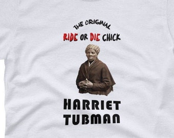 May include: White t-shirt with a black and white image of Harriet Tubman. The text "The Original Ride or Die Chick" is in red letters above the image and "Harriet Tubman" is in black letters below the image.