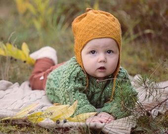 Texture knit baby hat with earflaps and ties in saffron