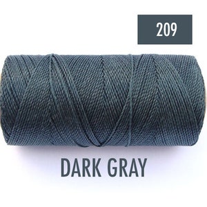 May include: A spool of dark gray waxed cotton cord, labeled "209" and "DARK GRAY".