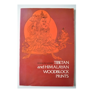 May include: A white ceramic mug with a black handle and the text "But First, Coffee" in a bold, black font. The mug is set against a neutral background, highlighting its simple design.