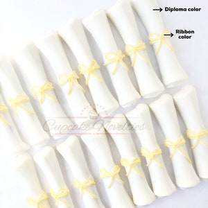 May include: White chocolate graduation diplomas with yellow ribbon bows.  Diploma color and ribbon color are indicated by arrows.