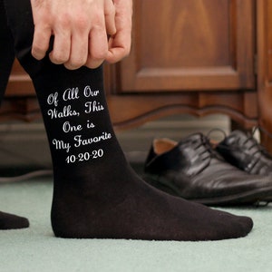 Custom printed black flat knit dress socks digitally printed in white ink is your choice of wedding design, personalized with your wedding date and names make a great groom gift. Custom printed wedding socks make a fun special gift for your father.