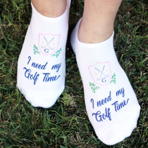 These comfy white cotton no show footie socks custom digitally printed with I need my golf time design make the perfect tournament tee gifts or party favors or just wear them when you golf or show them off to all your girlfriends at the club.