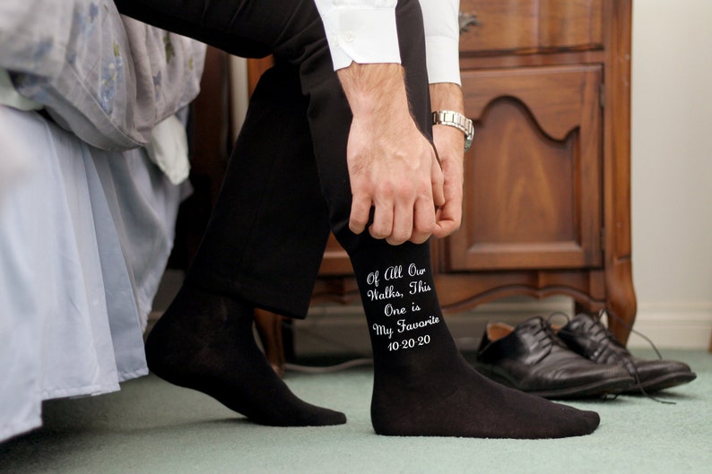 Custom printed black flat knit dress socks digitally printed in white ink is your choice of wedding design, personalized with your wedding date and names make a great groom gift. Custom printed wedding socks make a fun special gift for your father.