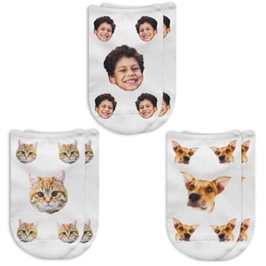 The faces on this design are printed in a pattern on the top of the socks so it will be seen on the top of the foot when worn.  Use people or pet faces for a pair of awesome custom printed socks.  One large face surrounded by four smaller faces.