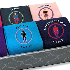 Amazing gift for the whole wedding, these printed and personalized wedding party dress socks inspired by star wars we digitally print your character, the wedding role, and your wedding date on flat knit dress socks or rib knit crew socks.