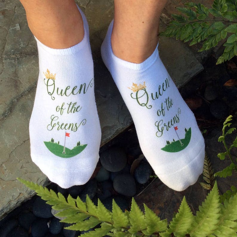 Super cute white cotton no show footie socks custom digitally printed with queen of the greens golf design make the perfect tournament tee gifts or party favors or just wear them when you golf and show them off to all your gal pals at the club!