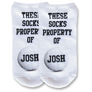 Custom printed and personalized with your name or initials these golf theme design digitally printed in ink on white cotton no show footie socks make the perfect tee tournament gifts.